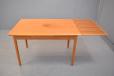 Compact vintage teak dinign table with 2 pull out leaves