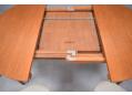 Self stored leaf folds like a butterflys wings inside the table
