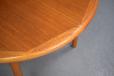 Teak dining table extending with one central leaf produced by Danish Mobelfabrik