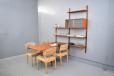 Teak modular shelving system with wall mounted dining table by Poul Cadovius