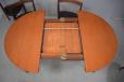 Vintage teak round table with 6 matching side chairs made in Denmark