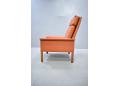 Stylish Danish design armchair with high back rest and original leather.