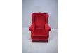 Stylish and compact wingback armchair in red velour upholstery