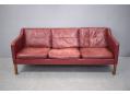 Box frame 3 seat sofa with original leather and wooden legs.