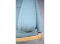 Wood frame end sofa in beech with light blue fabric upholstery.