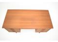 Rectangular teak desk with lots of practical drawer storage.