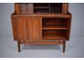 Sliding doors on on the large cupboard reveal internal shelved storage