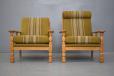 Oak frame pair of armchairs with sprung cushions