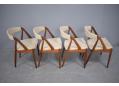Burma teak framed model 31 dining chairs with oiled finish.