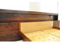 Very wide spacious headboard with lots of storage for books.