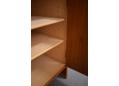 The cabinet has 4 shelves that are made of solid block wood.