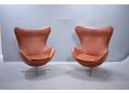 Matching pair of EGG CHAIRS in matching leather.