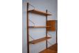 Wall mounted teak shelving system designed in 1947 by Poul Cadovius