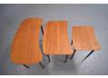 Danish nesting tables in teak with tapering round legs.