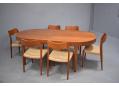 Vintage Arne Hovmand-Olsen dining table in teak with 2 fold-away leaf extensions. 