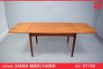 Compact vintage teak dining table with 2 draw leaves - view 1