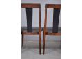 Black vinyl upholstered dining chairs in rosewood. Hans Olsen design model 771
