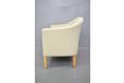 Cream curved sofa produced by Danish Mobelfabrik