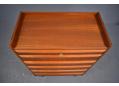 6 drawer teak chest with raised edges & lipped handles.