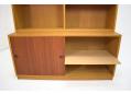 1955 design oak wall unit with 2 teak sliding doors & adjustable shelves.