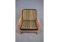 Midcentury Danish design armchair with light oak frame.