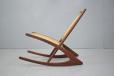Vintage 1960s teak frame rocking chair with woven cord back and seat rest