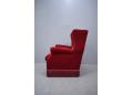 Strong framed Danish design wing back chair in red velour upholstery.