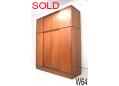 Danish wardrobe storage unit with sliding doors and gents dressing mirror.