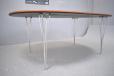 The table stands on chrome legs which can be removed for transport.