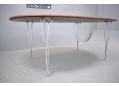 The table stands on chrome legs which can be removed for transport.