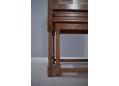 Turned legs combine with the carved detail to give this cabinet antique appeal.