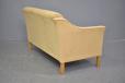 Cream curved sofa produced by Danish Mobelfabrik