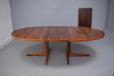 Rosewood oval top dining table on pedestal legs extending with 2 extra leaves produced 1960s by Helteborg Mobler