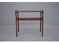 Beautiful circular legs hold up this lovley rosewood coffee table 