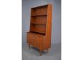 Secretair writing bureau in teak with bookcase top.