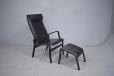 Modern Danish armchair with high back, matching stool and black leather upholstery - view 6