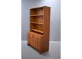 Teak storage unit with bookcase top & chest of drawers base.