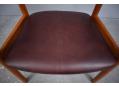 Burgundy leather upholstered seat on pitch pine frame armchair