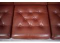 Seat  cushions with deep seated buttons and pattern sewn leather cover. 