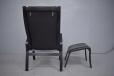 Danish design high back amrchair in black leather with matching footstool