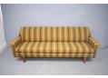 3 seat sofa bed settee with its original striped woolen upholstery.