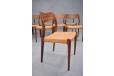 10 model 71 rosewood framed dining chairs with woven papercord  seats by Niels Moller.