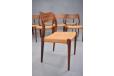 10 model 71 rosewood framed dining chairs with woven papercord  seats by Niels Moller.