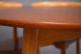 Laminated teak table top is matched by laminated teak chair seats