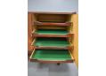 Shallow cutlery drawers lined with green felt. A standard Danish lining 