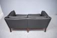 2 seat sofa in black colour leather upholstery with classic box frame. 