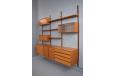 Wall mounted modular shelving system designed in 1947 by Poul Cadovius