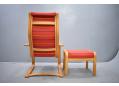 High back beech easy chair & matching footstool in red fabric upholstery. 