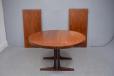 Midcentury rosewood circular dining table on pedistal legs produced by Rosengaarden