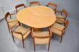 Vintage beech round top dining table extending with one leaf for sale